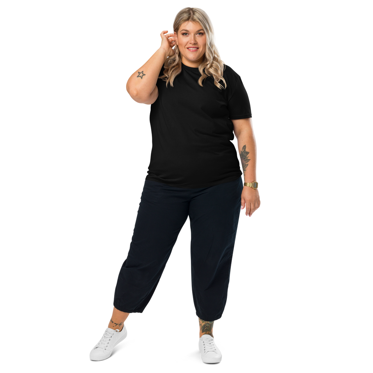 Person wearing a plain black unisex organic cotton T-shirt, front view