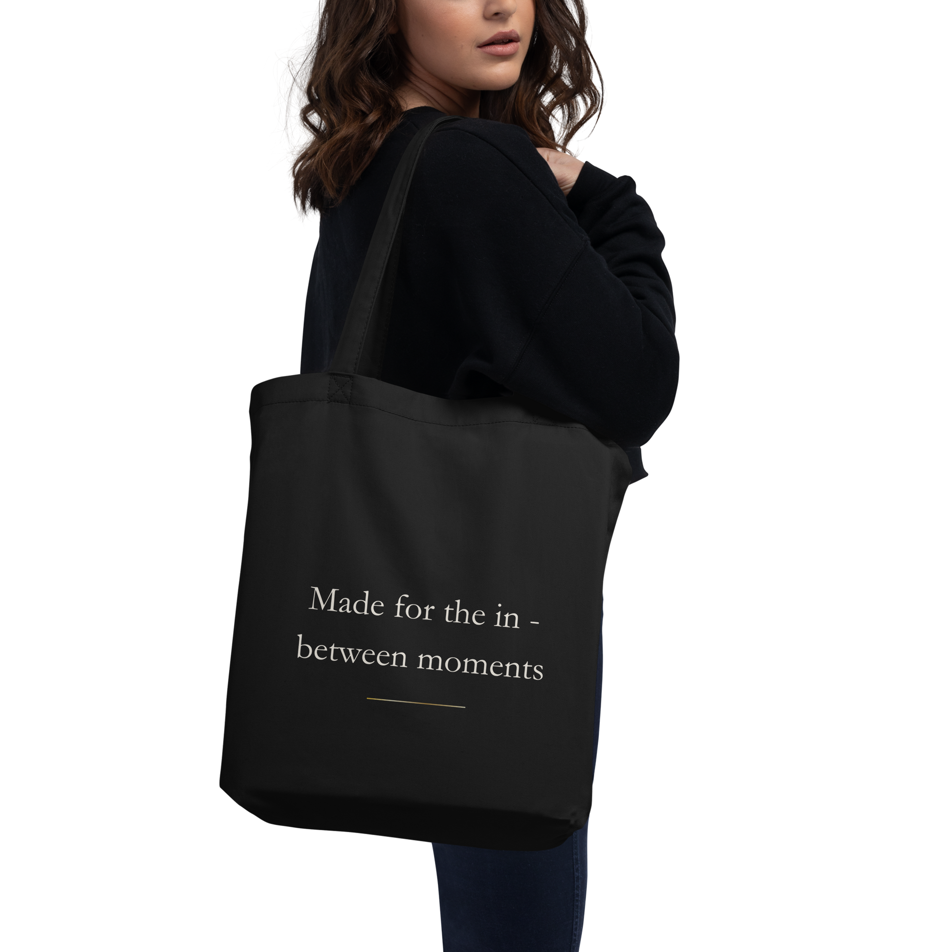 close-up detail of the black LumineStudio eco tote bag with organic certification label