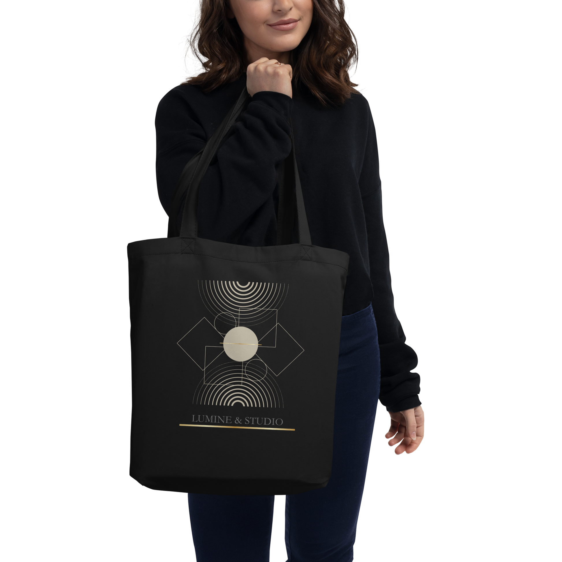 Person carrying the black Lumine Studio eco tote bag with minimalist geometric design