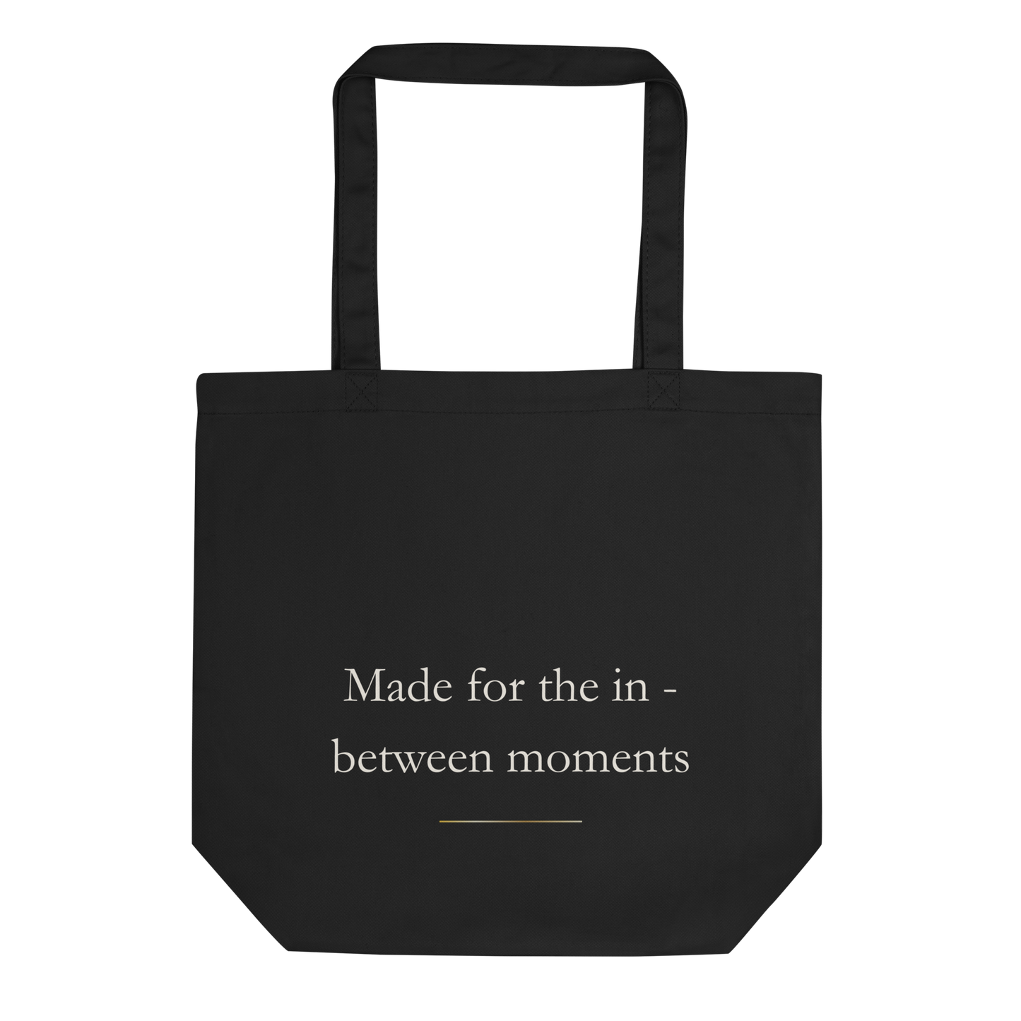 Back view of the black Lumine Studio eco tote bag with Made for the in between moments text