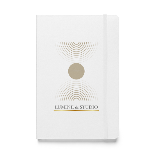 White Lumine Studio hardcover notebook ith minimalsit gold geometric design, front view