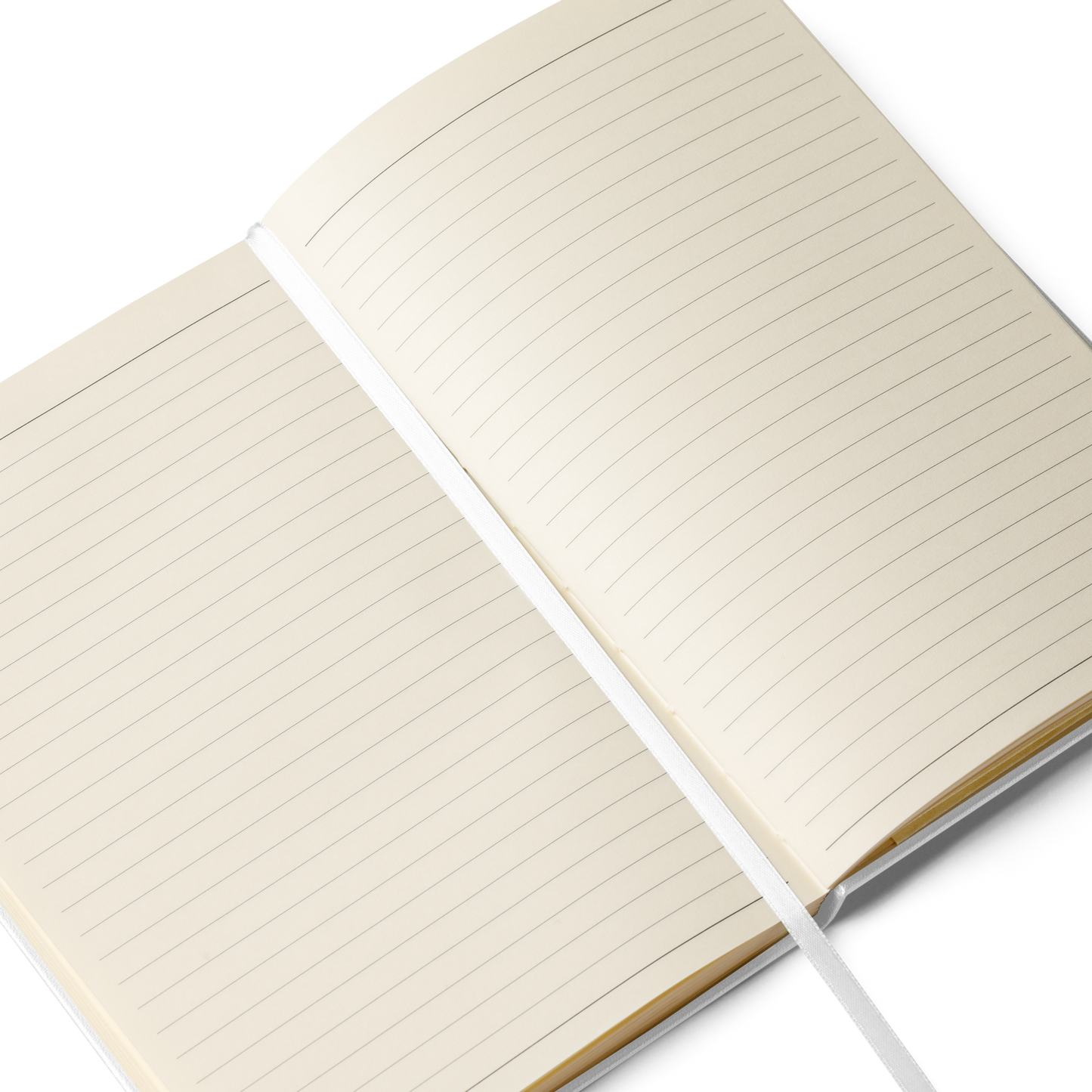 Open white Lumine hardcover notebook showing cream lined pages and white ribbon bookmark