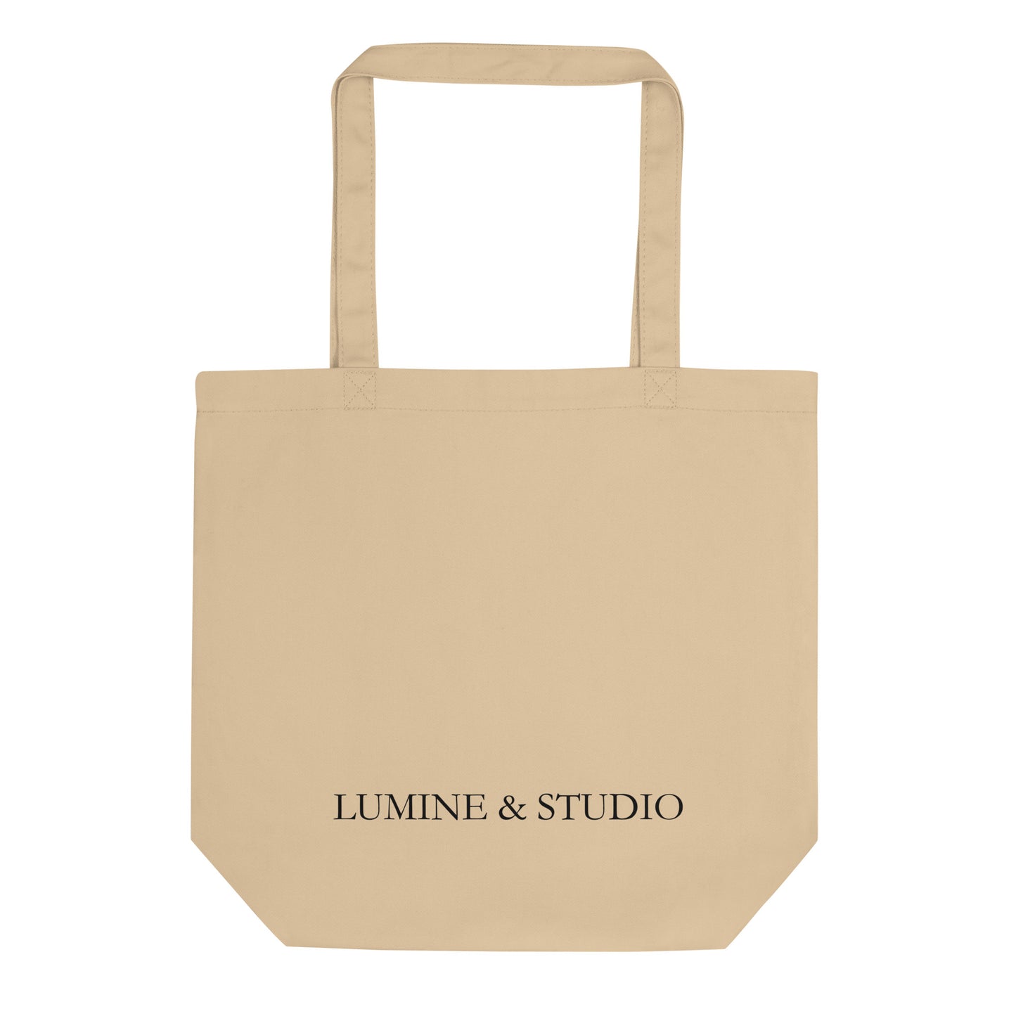 Back view of the beige lumine tote bag with subtile Lumine Studio branding