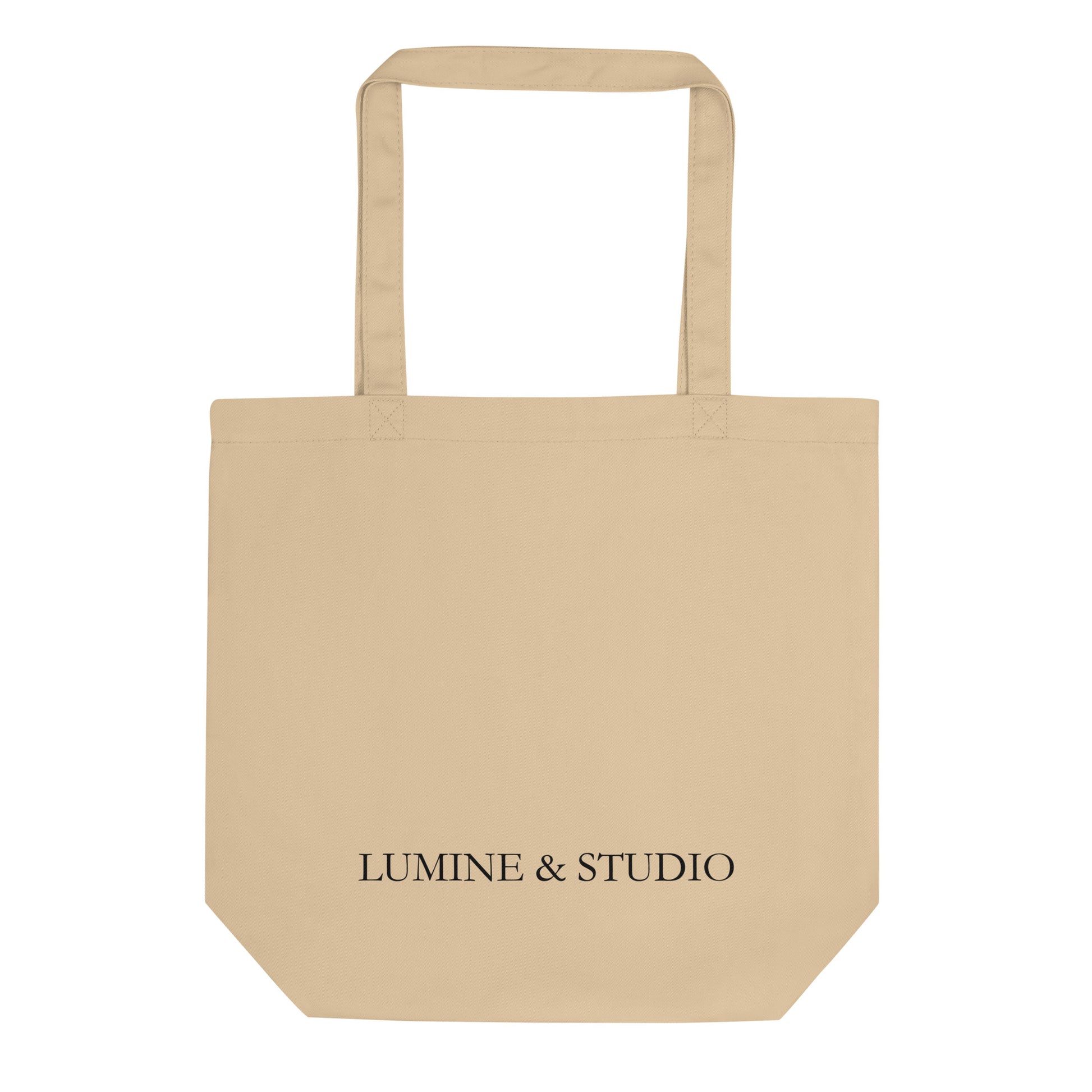 Back view of the beige lumine tote bag with subtile Lumine Studio branding