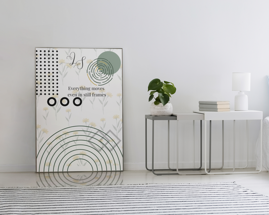 Minimalist abstract botanical wall art displayed in a bright neutral living room with a small table, books and plant.