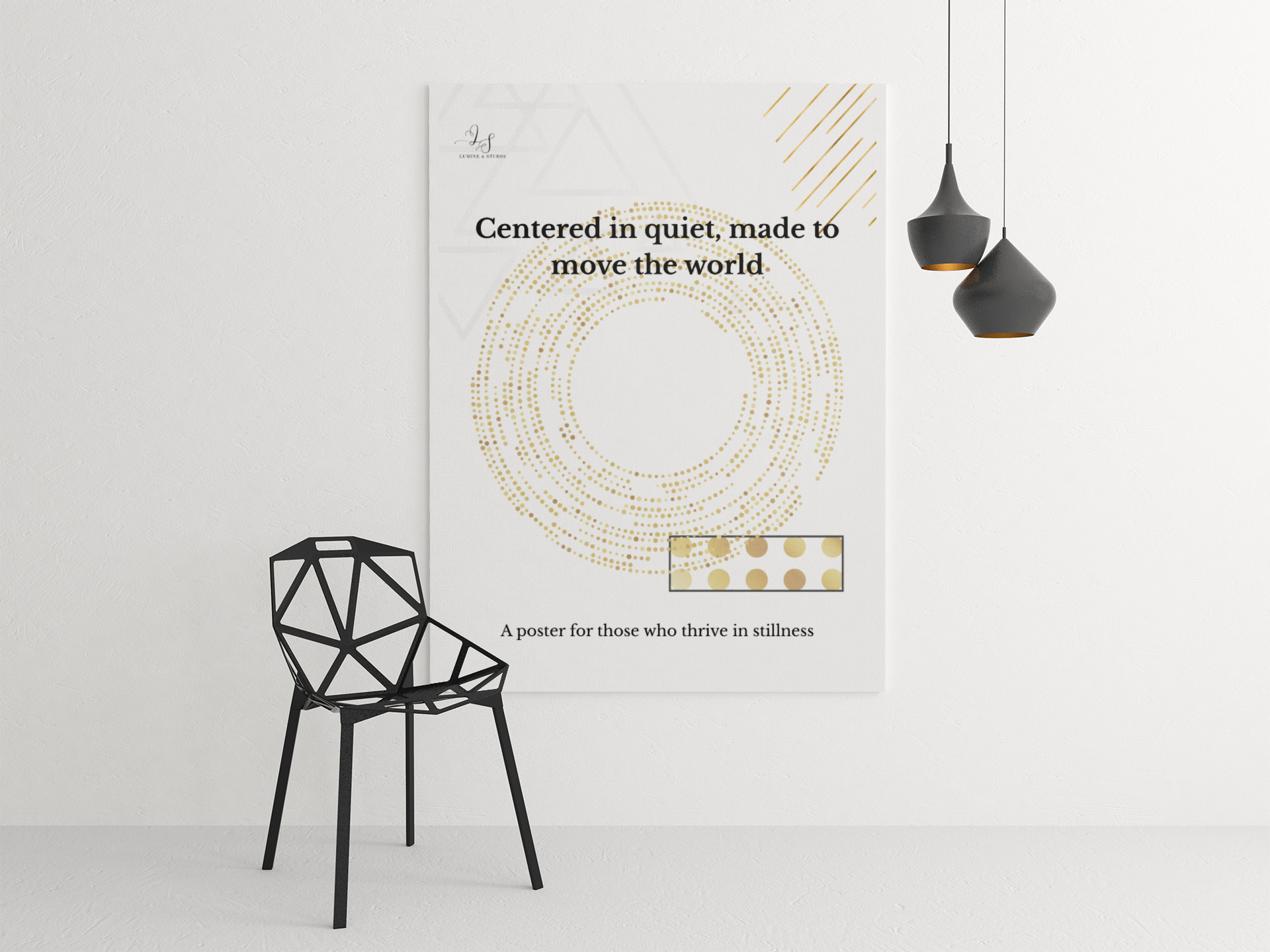 Minimalist geometric wall art displayed beside a modern black chair and pendant lights
