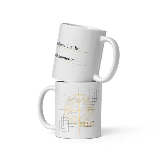 White 11 oz eramic mug with abstract geometric line art in gold and black, shown from both sides.