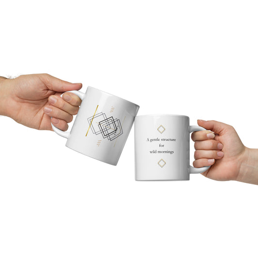White 20 oz ceramic mug with minimalist quote design, held by hand against clean white background.