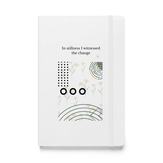 White hardcover notebook with minimalist abstract botanical and geometric artwork and typography on the cover.