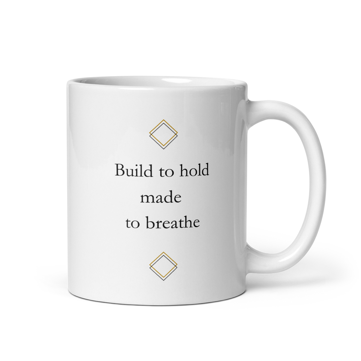 White 11 oz ceramic mug with minimalist typography reading "Build to hold, made to breathe" and subtle geometric details.